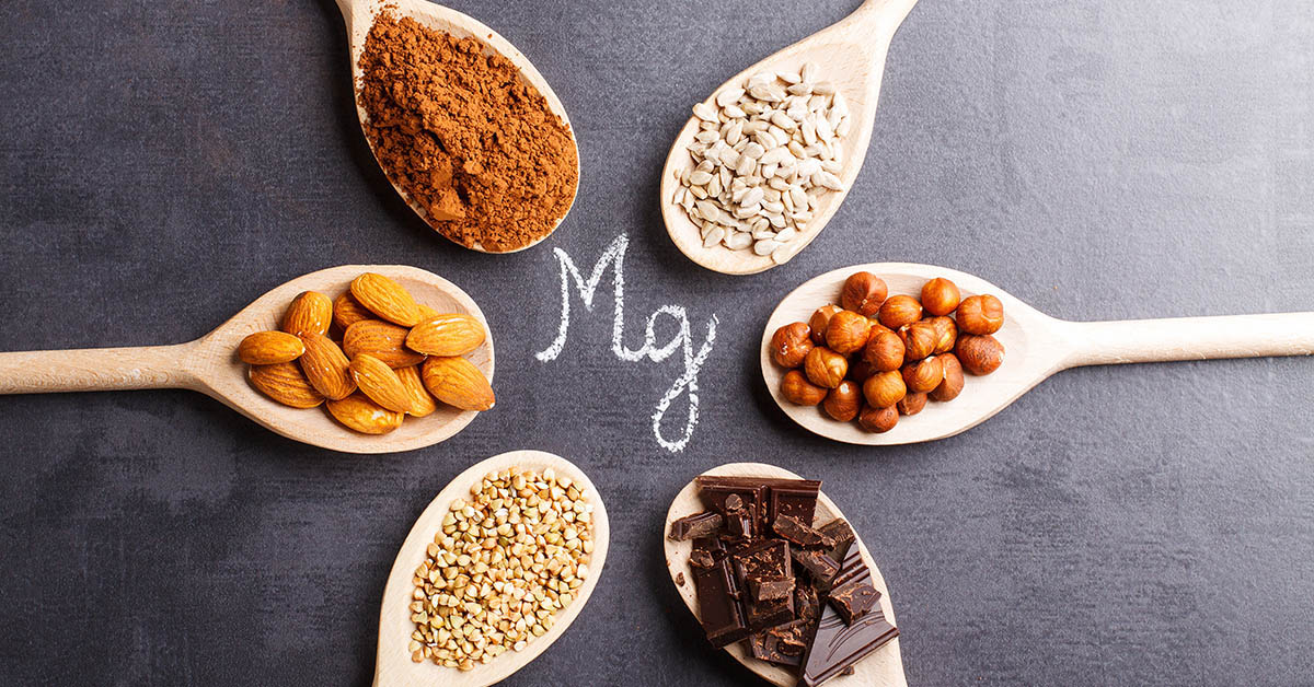 Products rich in magnesium on wooden spoons.